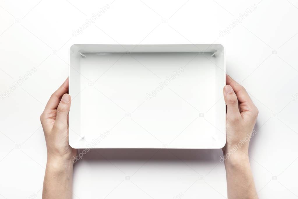 holding a white box