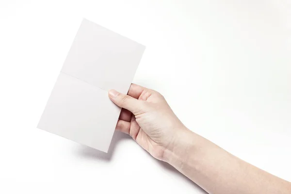 Holding a white postcard. — Stock Photo, Image