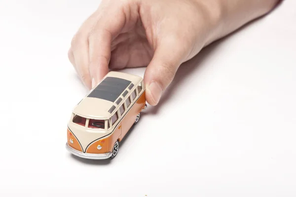 Holding a mini car, bus — Stock Photo, Image