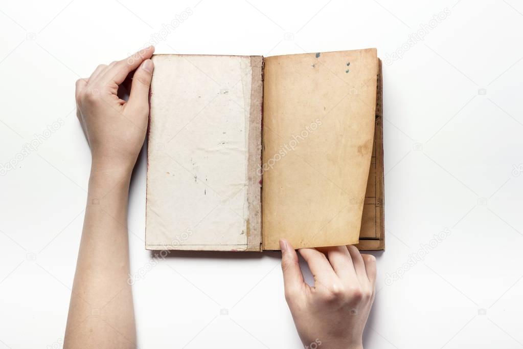 holding a asian vintage book isolated white.