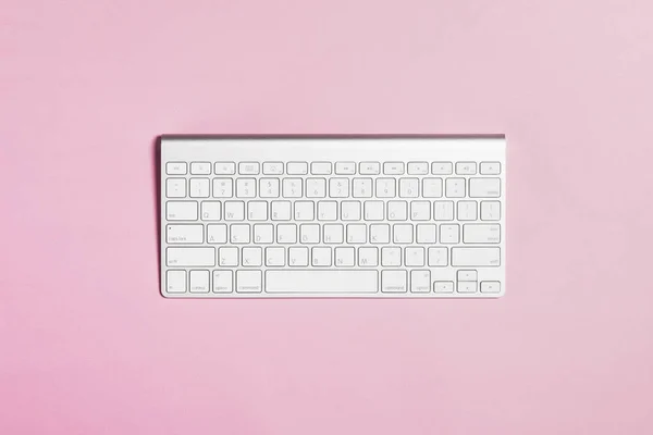 keyboard on pink background.