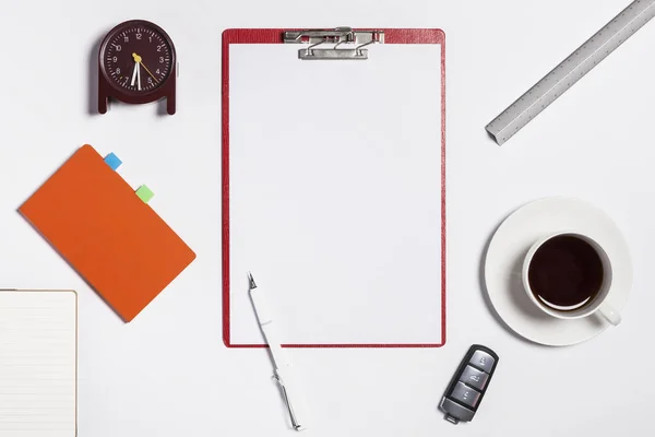 Note book(clipboard) and office supplies on desk isolated Stock Picture