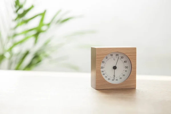 desktop wood clock on daylight wood desk