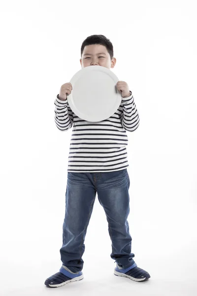 Ein Dicker Junge Mit Einem Teller — Stockfoto
