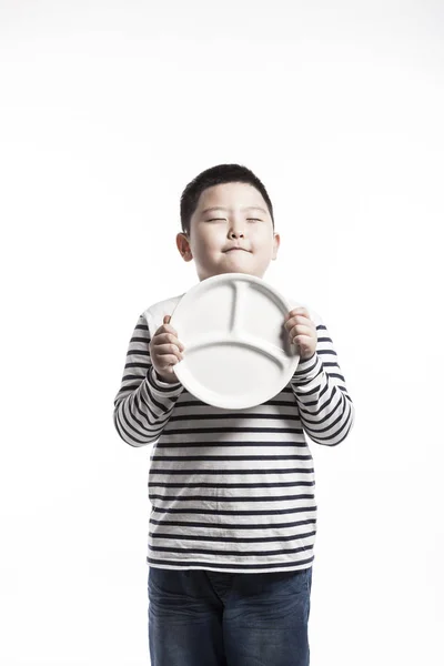 Ein Fetter Junge Mit Einem Teller — Stockfoto