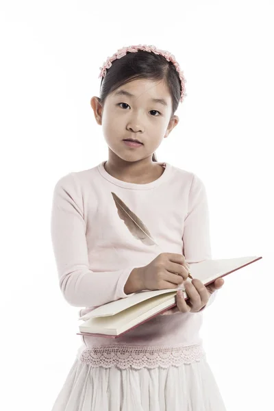 Little Girl Holding Book Feather Pan While Standing Studio Isolated — Stock Photo, Image