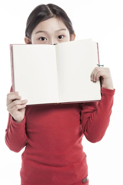 Little Girl Holding Book While Standing Studio Isolated White Background — Stock Photo, Image