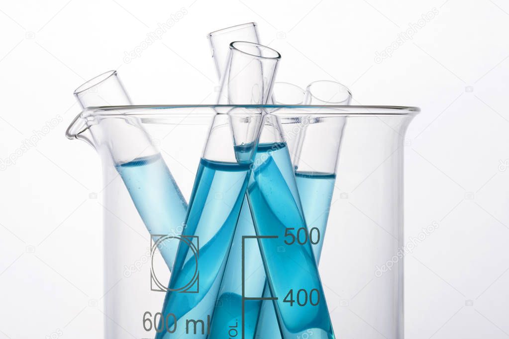 Laboratory graduated cylinders and beaker isolated on white background