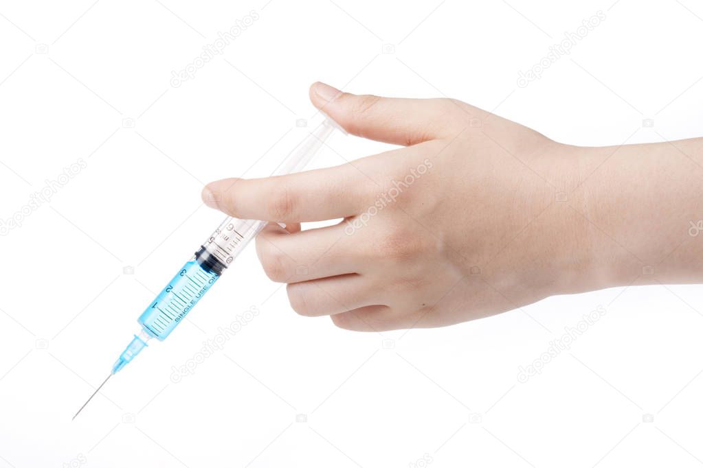 Syringe in hand isolated on white background