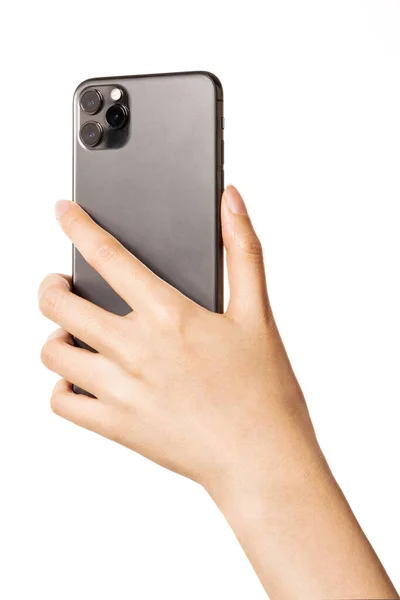손에는 스마트폰을 카메라쪽은 흰색으로 분리되어 — 스톡 사진