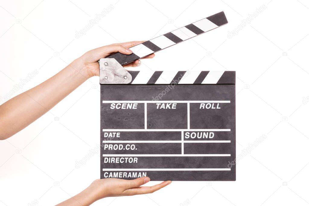 Woman hand hold a movie clapper isolated on white.