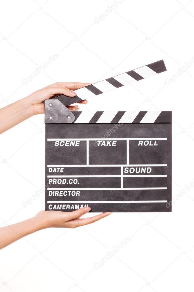 Woman hand hold a movie clapper isolated on white.