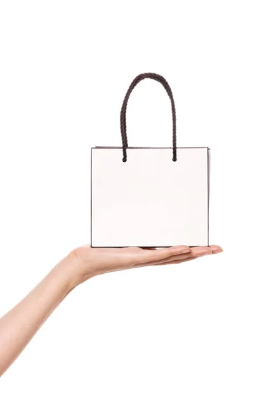 Frauenhand Hält Eine Kleine Weiße Einkaufstasche Isoliert Auf Weißem Grund — Stockfoto