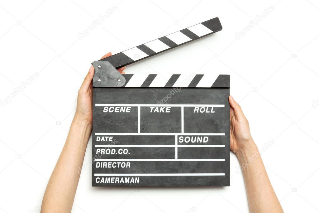 Woman hand hold a movie clapper isolated on white.