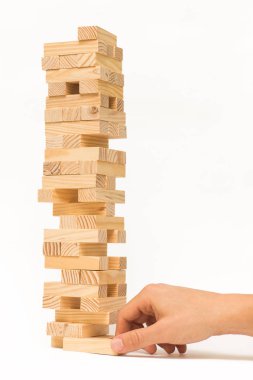 Tahta bloklar Jenga oyunu ve elini Kulesi