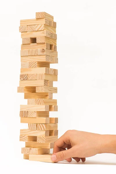 Tahta bloklar Jenga oyunu ve elini Kulesi