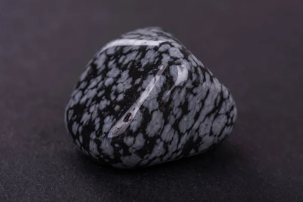 Obsidian geode on black background