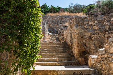 Stairs with greenery at Spinalonga fortress later a leper colony. clipart