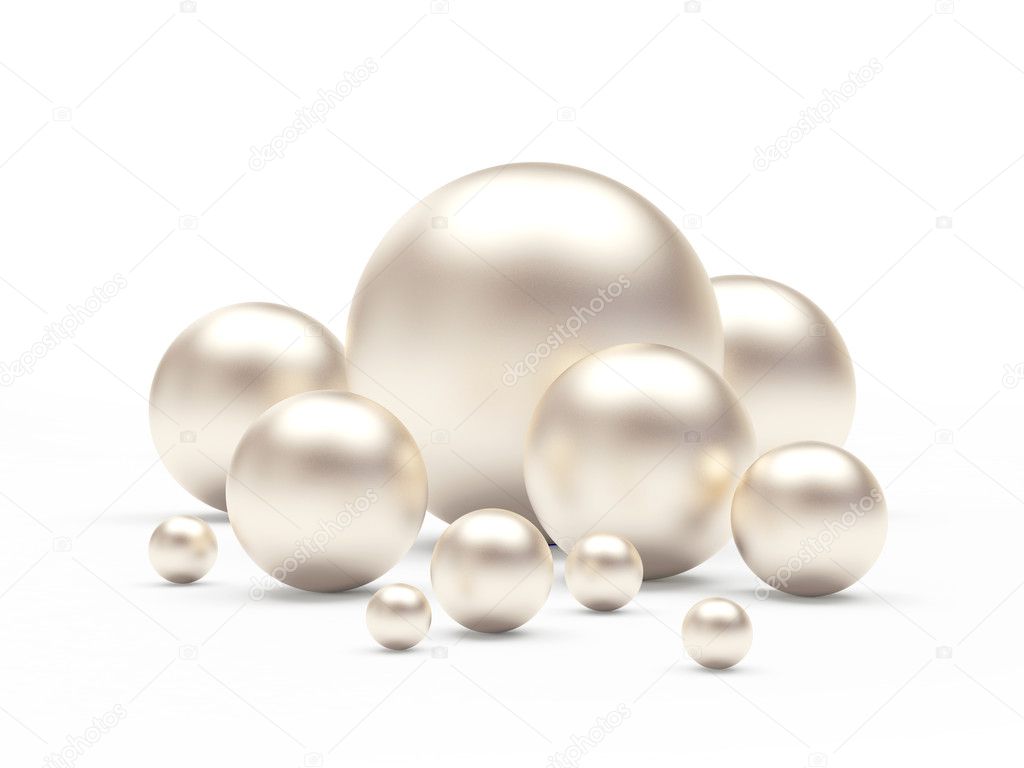 Group of white pearls of different sizes on white 