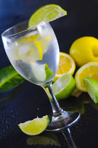 Lemon water and citrus fruits — Stock Photo, Image