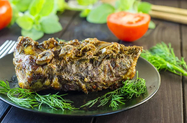 Pork meat on ribs baked in an oven — Stock Photo, Image
