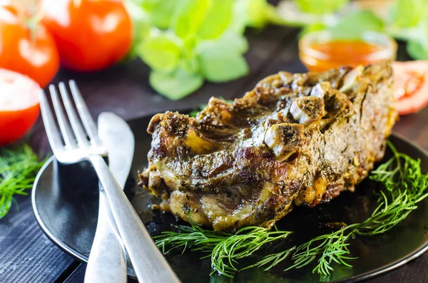 Pork meat on ribs baked in an oven — Stock Photo, Image