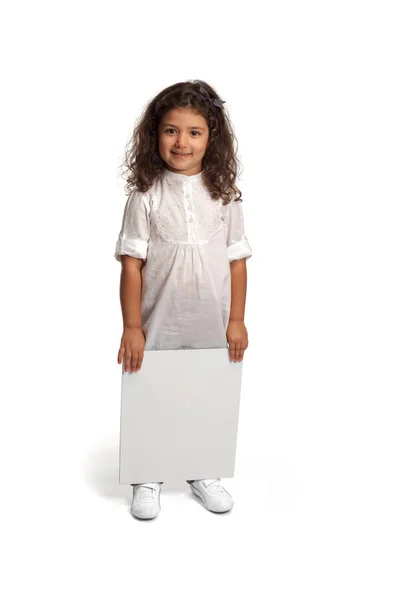 Cute little girl with blank placard — Stock Photo, Image