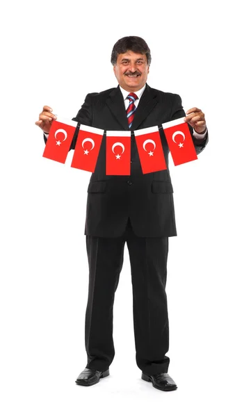 Mogen affärsman holding flaggor i Turkiet — Stockfoto