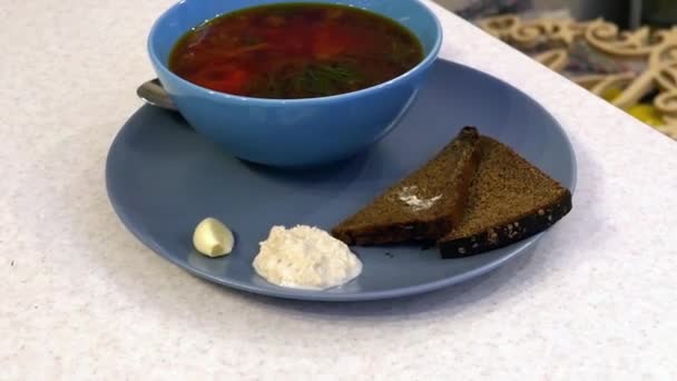 Soup in a blue plate — Stockvideo