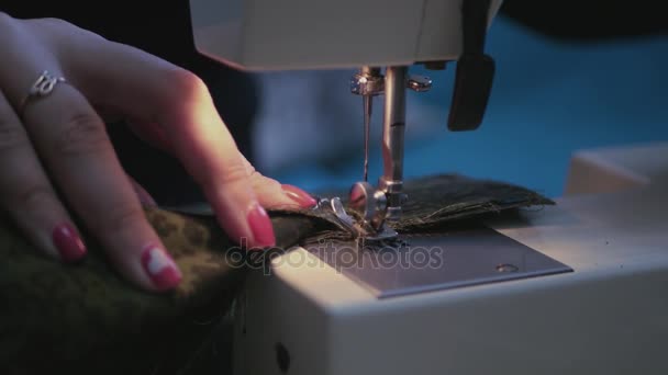 Girl with beautiful red nails on the sewing machine sews a beautiful green dress, cut with scissors thread, 3840x2160, 4k, — Stock Video