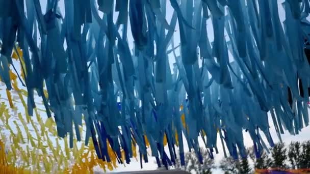 Beautiful blue ribbons in the park hanging and swaying in the wind. slow motion. 1920x1080. full hd — Stock Video
