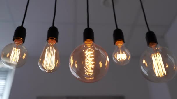 Edison lamp is glowing, electric bulb, turning the lights on, electric light, incandescent lamp, hot spiral of tungsten bulb — Stock Video
