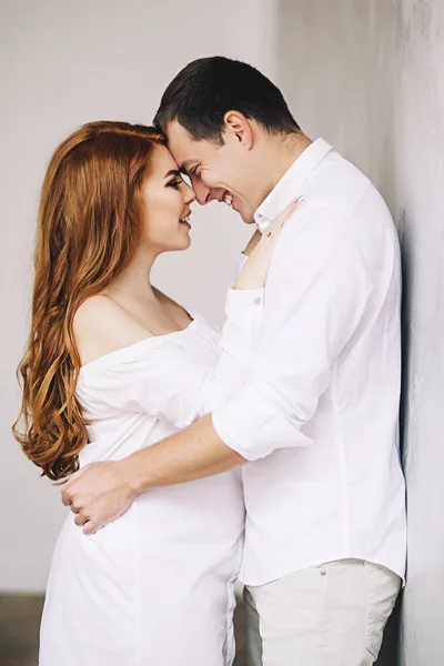 Happy future parents are waiting for baby, married couple is waiting for a child, pregnant woman with red long hair, beauty of pregnancy, love and support in family — Stock Photo, Image