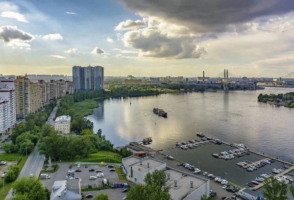 Top view of the Neva rivers and the urban Rybvtskoye microdistri — Stock Photo, Image