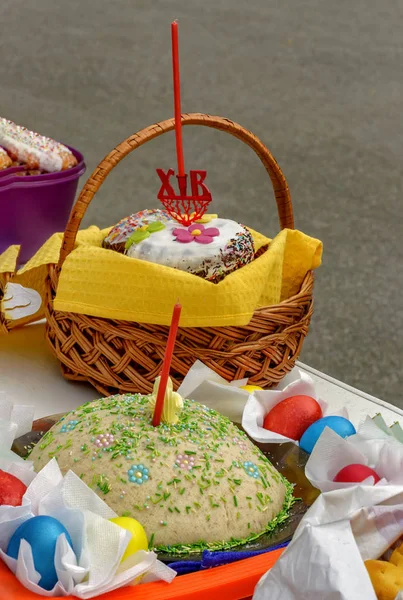 Easter eggs and cakes on lighting near the temple.