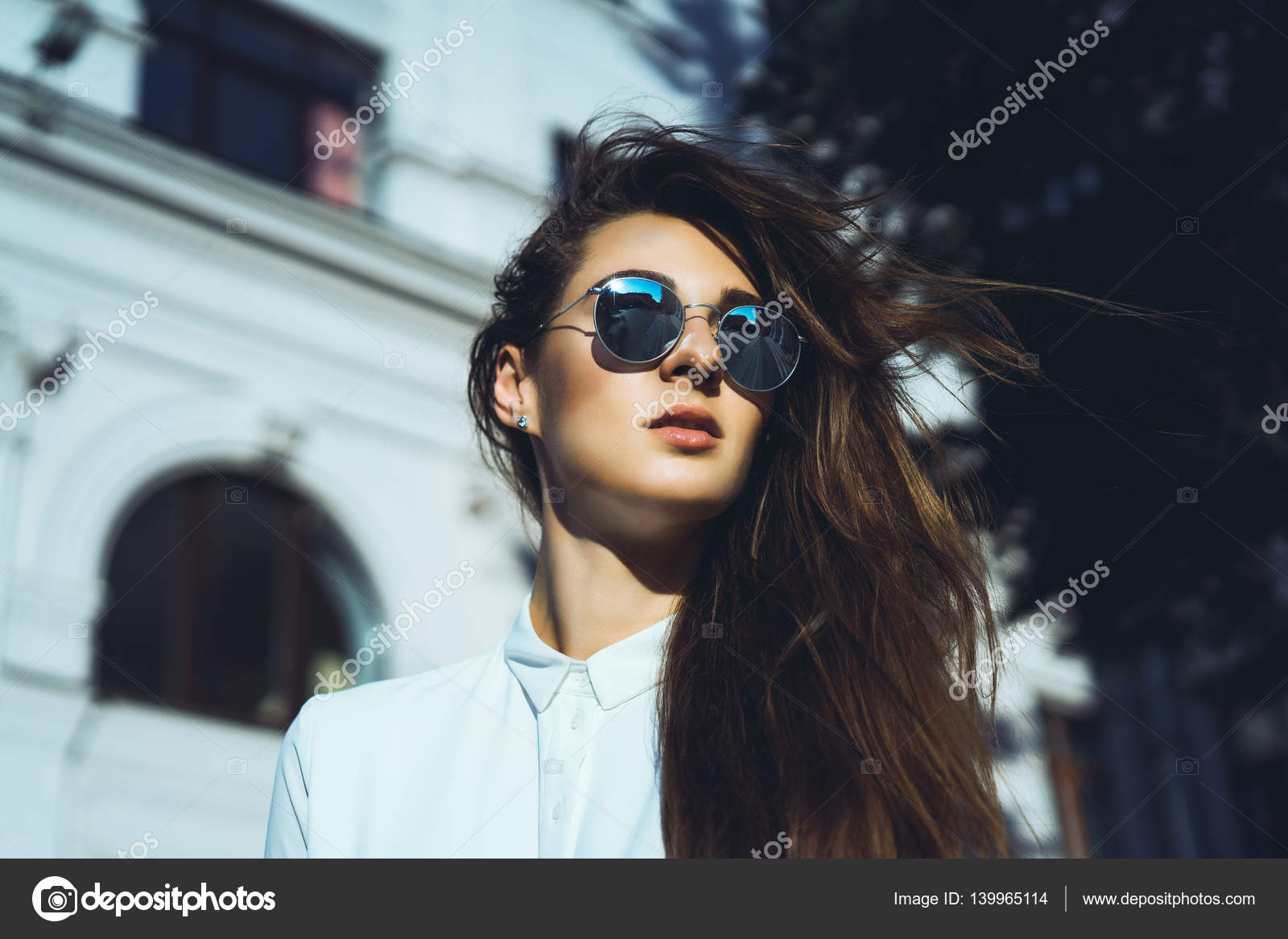 Young girl wearing sunglasses Stock Photo by ©sergey_causelove 139965114