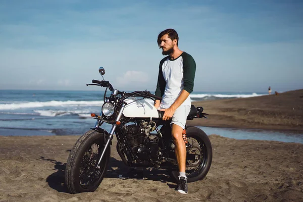 Man posing on vintage motorcycle — Stock Photo, Image