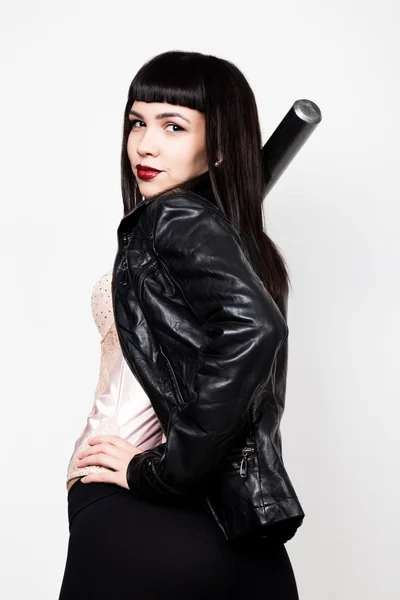 Young beautiful woman in a leather jacket, posing with baseball bat. — Φωτογραφία Αρχείου