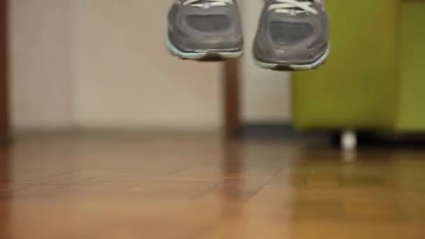 Close-up shot of woman jumping on a skipping rope in a gym. Sports concept — Stock Video