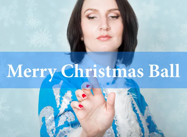 Merry christmas ball written on virtual screen. concept of celebratory technology in internet and networking. woman in cristmas uniform presses button on virtual screens — Stock Photo, Image