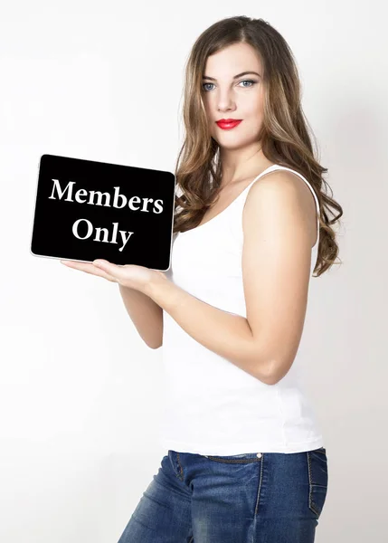 Mambers only written on virtual screen. technology, internet and networking concept. beautiful woman with bare shoulders holding pc tablet — Stock Photo, Image