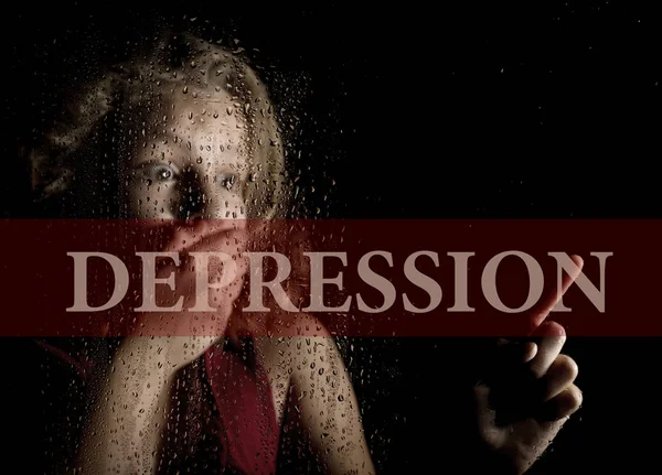 Depressie geschreven op virtueel scherm. hand van bang meisje melancholie en verdrietig bij het raam in de regen. — Stockfoto
