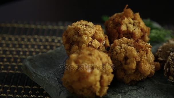 Homemade meat cutlets in batter with parsley, ketchup and bread on stone — Stock Video