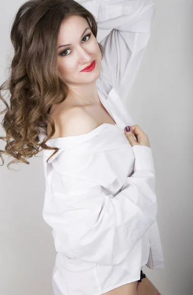 Young beautiful woman in white mens shirt — Stock Photo, Image