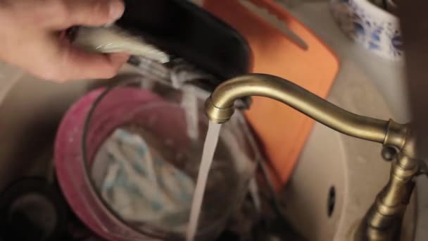 Man washes a dishes, close-up of hands and sponge — Stock Video