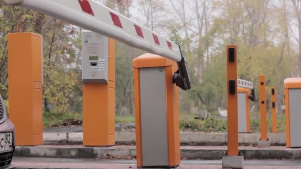 Automatic road barrier gate lifting gate opens and passes car — Stock Video