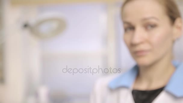 Female doctor, nurse in hospital shows the pills to be taken to his patient — Stock Video