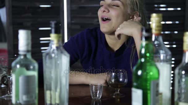 Lonely young woman drinks alcohol at bar and talks to herself — Stock Footage Lonely young woman drinks alcohol at bar and talks to herself Stock Footage
