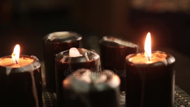 Foot massage in thai studio. Professional therapist giving traditional Thai massage. close up candles — Stock Video