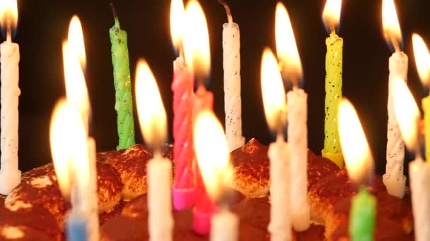 Woman lights candles on tasty birthday cake. Slow motion — Stock Video